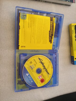 Cyberpunk 2077 PS4 + Guía + Steelbook