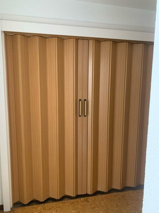 Puerta corredera plegable de fuelle