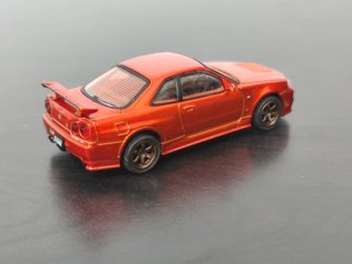Nissan Skyline GT R34 Naranja 1/64