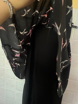 Tuta jumpsuit nera con fantasia di uccellini rosa