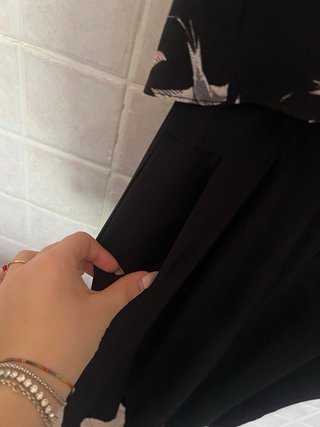 Tuta jumpsuit nera con fantasia di uccellini rosa