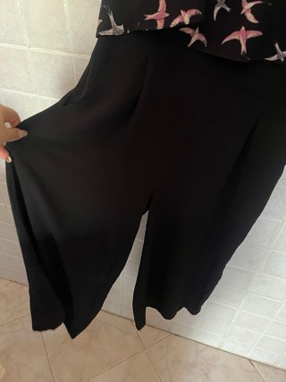 Tuta jumpsuit nera con fantasia di uccellini rosa
