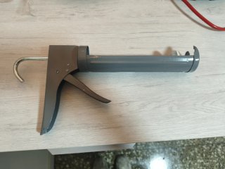 Pistola de silicona gris