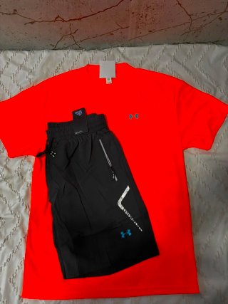 Conjunto deportivo Under Armour naranja y negro
