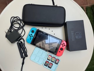 Nintendo Switch + 5 juegos + cables