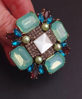 Broche joya piedras turquesa y burdeos
