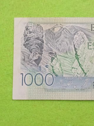 Billete usado con algún desperfecto del uso 1000