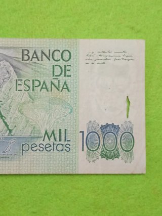 Billete usado con algún desperfecto del uso 1000