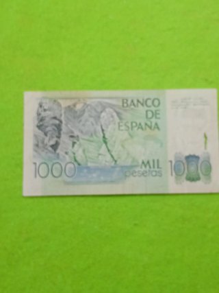 Billete usado con algún desperfecto del uso 1000