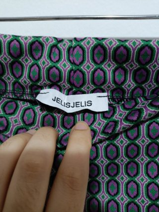 Pantaloni a zampa anni '70 fantasia geometrica