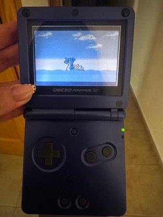 Game boy advance SP con su maletín + dos juegos.