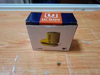 Candado de disco amarillo con funda