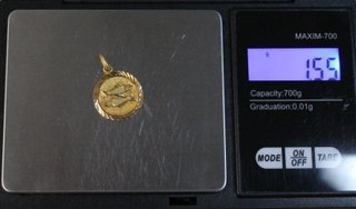 Colgante de oro de 18k. Peso: 1.55 gr.