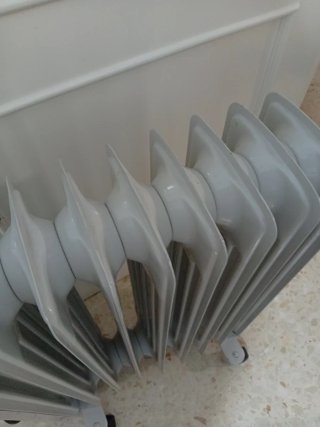 Radiador de aceite blanco y azul