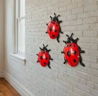 Decoración de 3 mariquitas metal.