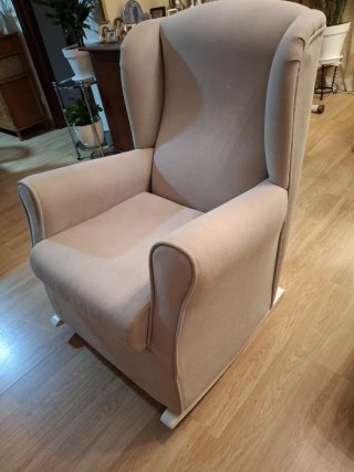 Poltrona a dondolo beige in tessuto