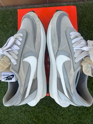Sneakers Nike grigie e bianche