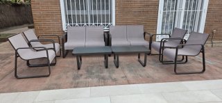 Conjunto sofás y mesas exterior.