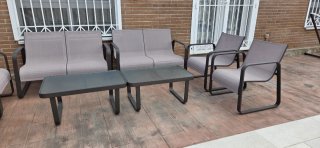 Conjunto sofás y mesas exterior.