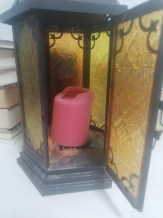 Farol de metal y cristal con vela