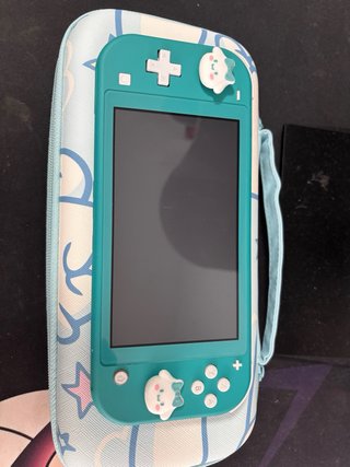 Nintendo Switch Lite Verde + 2 Juegos Negociable