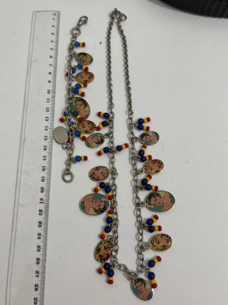 Set collana e bracciale vintage con ciondoli