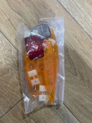 Catadiópticos bicicleta (naranja y rojo)
