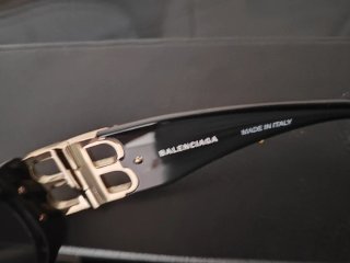 Occhiali da sole Balenciaga unisex neri e oro
