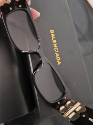 Occhiali da sole Balenciaga unisex neri e oro