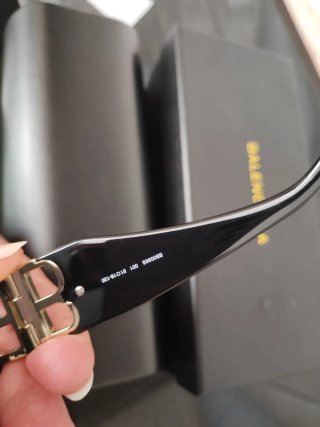 Occhiali da sole Balenciaga unisex neri e oro