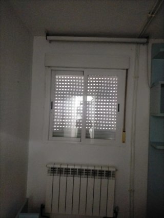 Ventana corredera con persiana