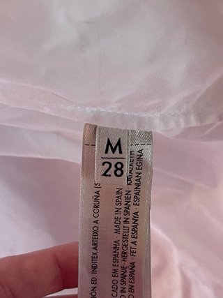 Blusa Uterqüe blanca con adornos