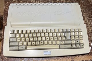 Amstrad CPC 6128 Plus + Mando + Burnin’ Rubber