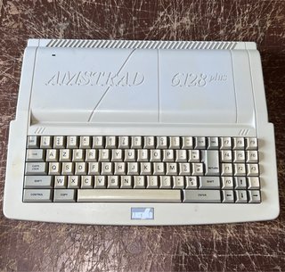 Amstrad CPC 6128 Plus + Mando + Burnin’ Rubber