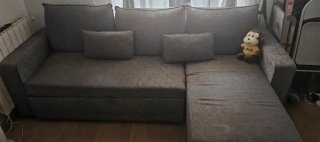 Sofá cama gris de tela