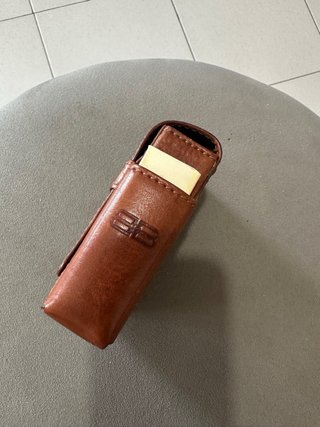 Porta sigarette Balenciaga in pelle con fiammiferi