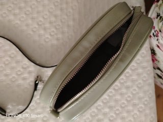 Bolso pálido verde muy práctico no pesa muy bonito