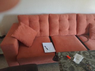 Sofá cama naranja de tela