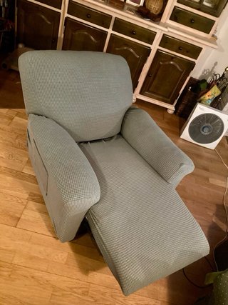Sillón reclinable gris tela