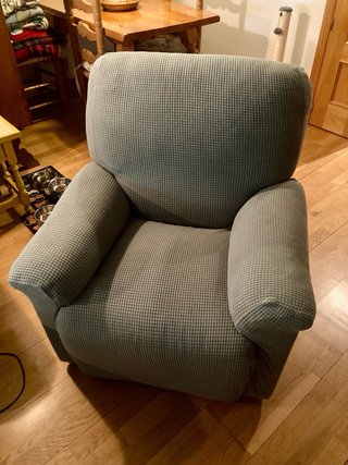 Sillón reclinable gris tela