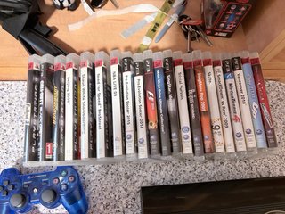 Consola PS3 + 6 Mandos + 2 Micrófonos + 22 Juegos
