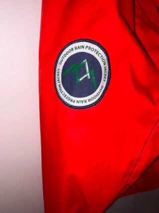 Cortavientos Quechua naranja niño
