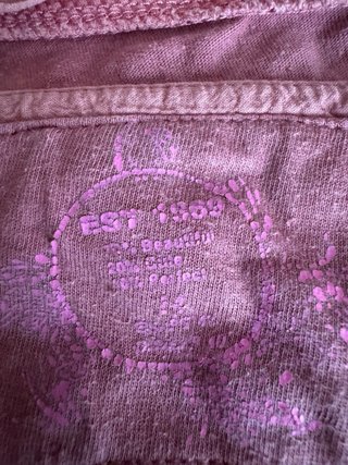 Camiseta sin mangas rosa con volantes