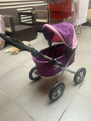 Carrito de muñecas morado y rosa