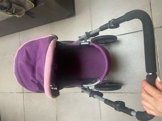 Carrito de muñecas morado y rosa