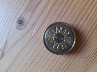 Sello de lacre con diseño de sol