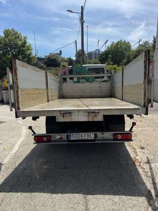 Camión grúa y volquete Nissan 70.14