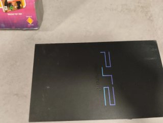 PlayStation 2 con Mando , 2 micrófonos y juegos