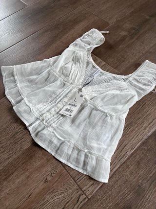 Blusa blanca con etiqueta talla L