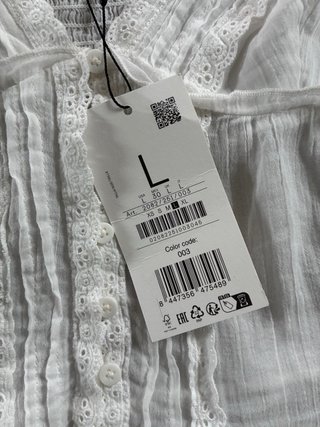 Blusa blanca con etiqueta talla L